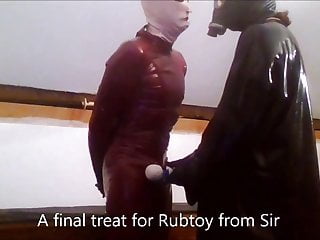 Rubtoy, In Latex Enjoying A Session On The Rack free video