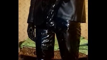 Guy In Latex Mask And Latex Shorts, Vinyl Pants And Gloves free video