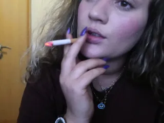 Close-Up Cigar Smoke By A Sexy Blonde Woman free video